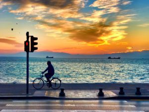 bicycle silhouette on the thessaloniki waterfront boardwalk at sunset