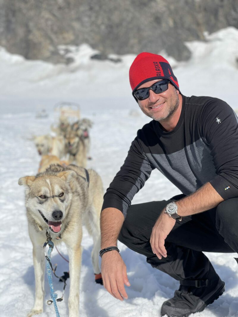 On a glacier in Alaska with a champion sled dog